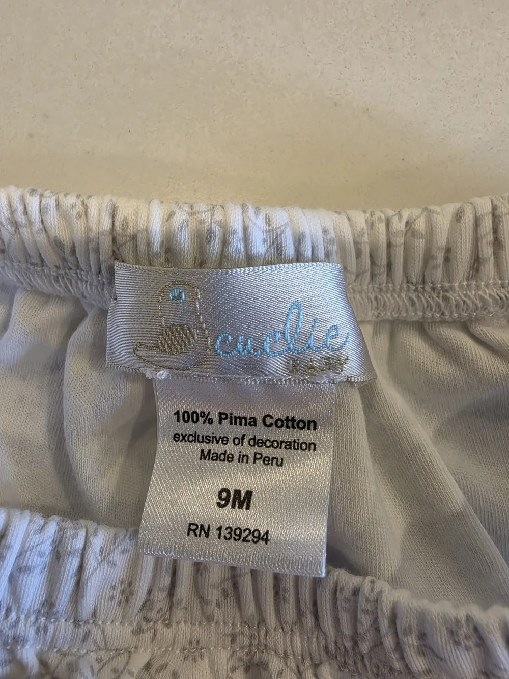 Cuclie Baby White/Gray Smocked Dress with Floral Print